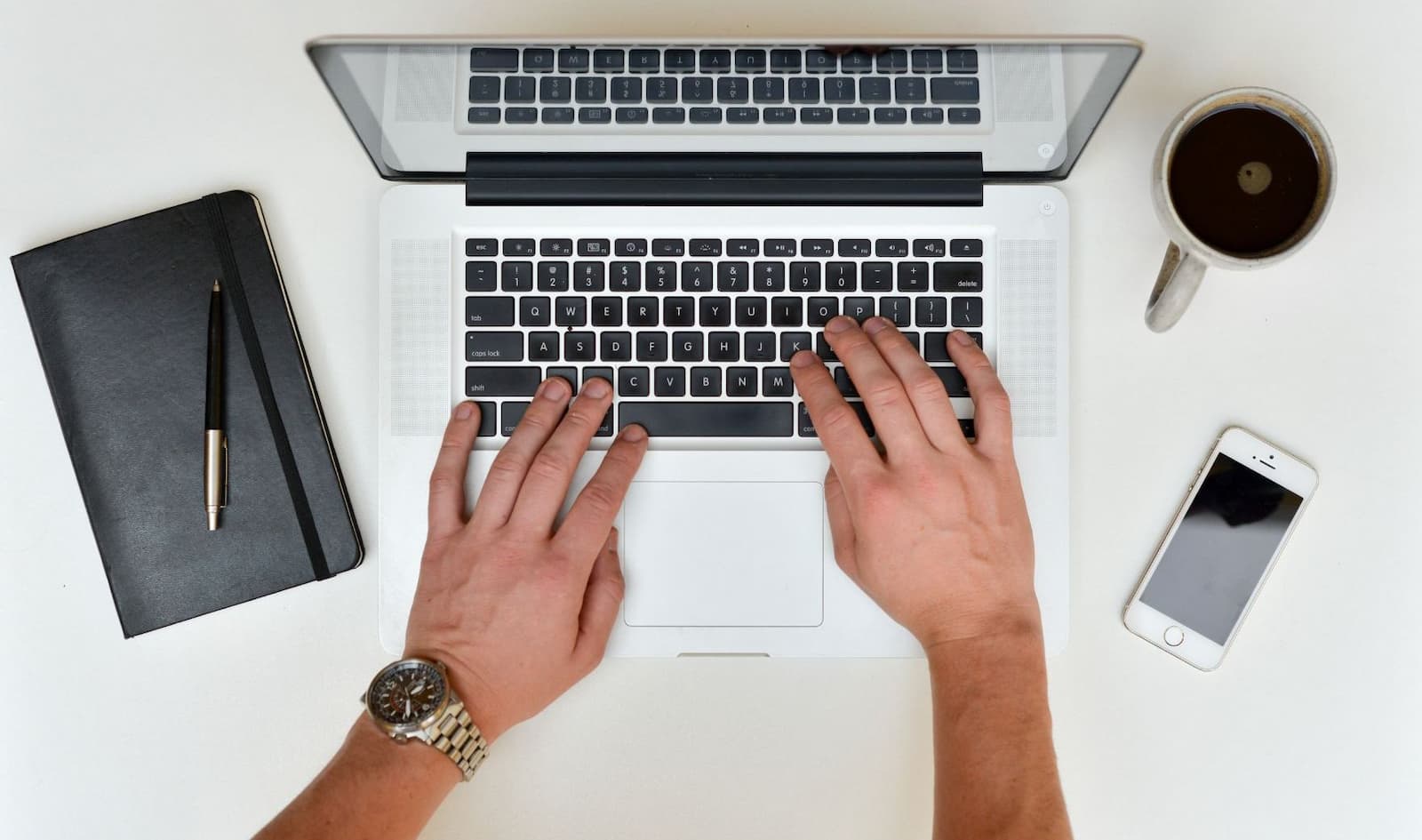 A person typing on laptop