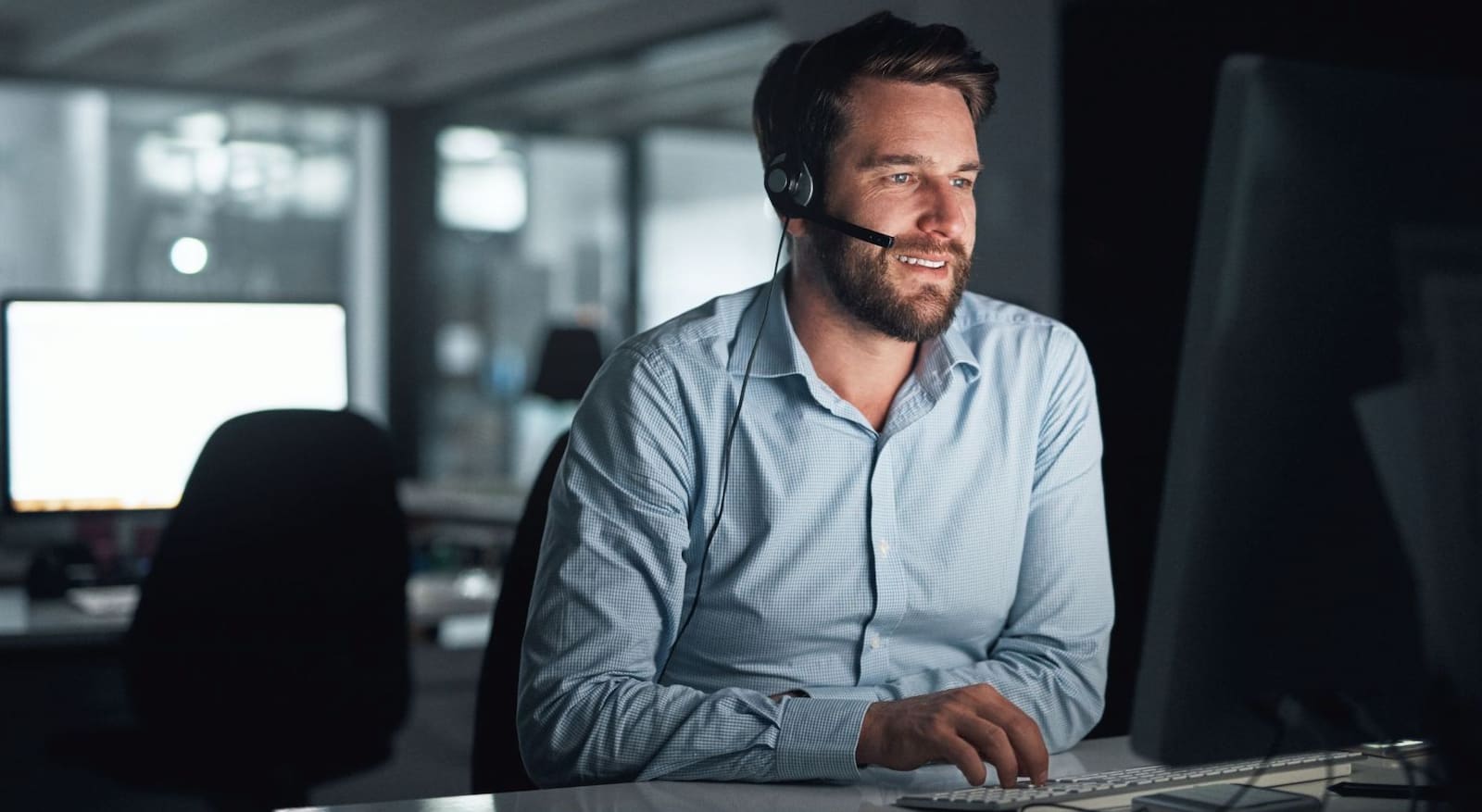 A man with headset working