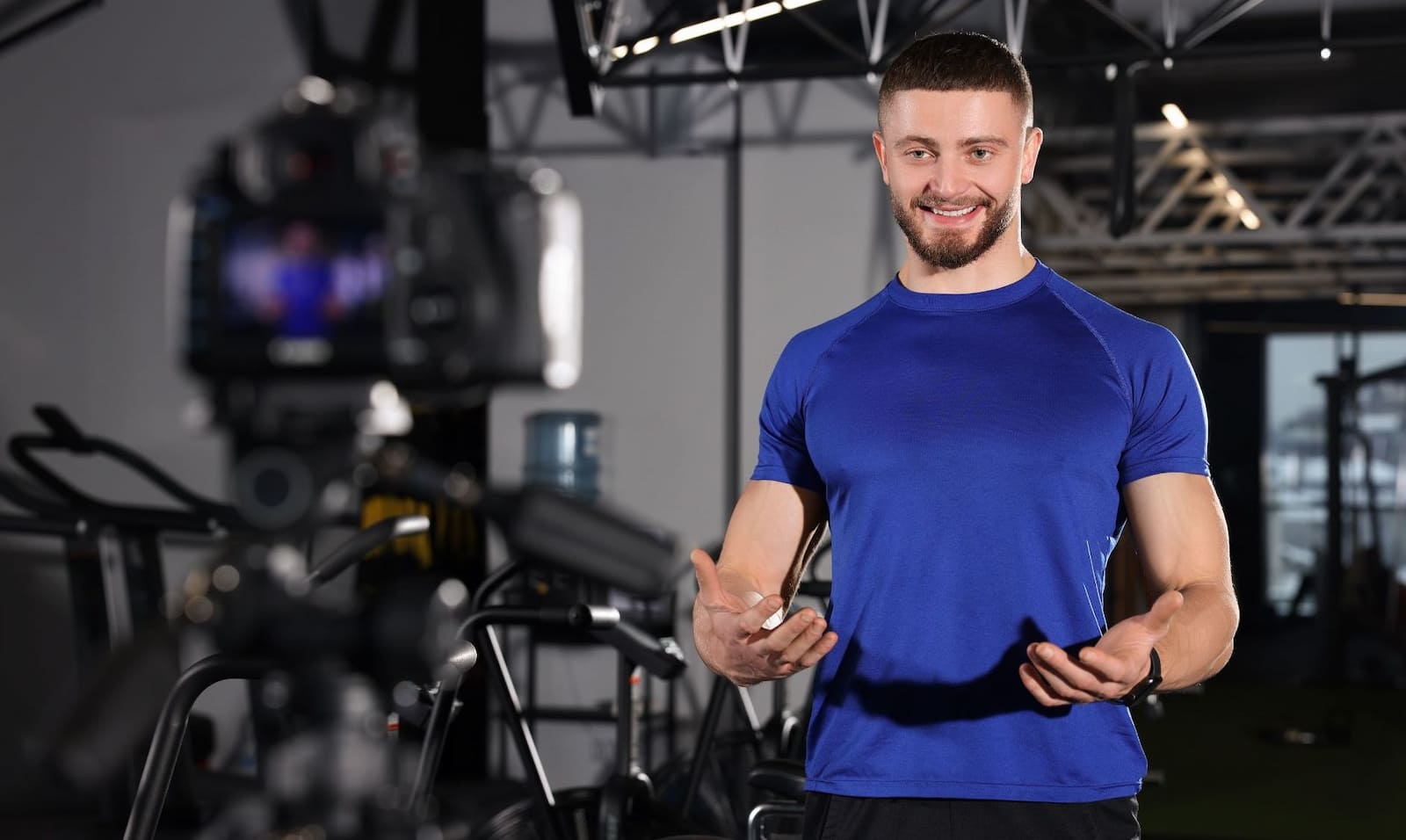 Online Fitness Coach talking in front of the camera