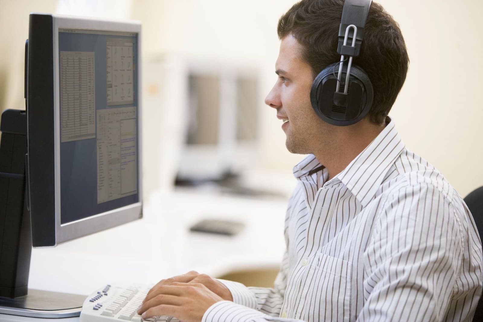 A man with headphones working